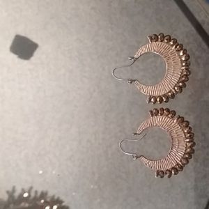 Gold hoop earrings with gold beads